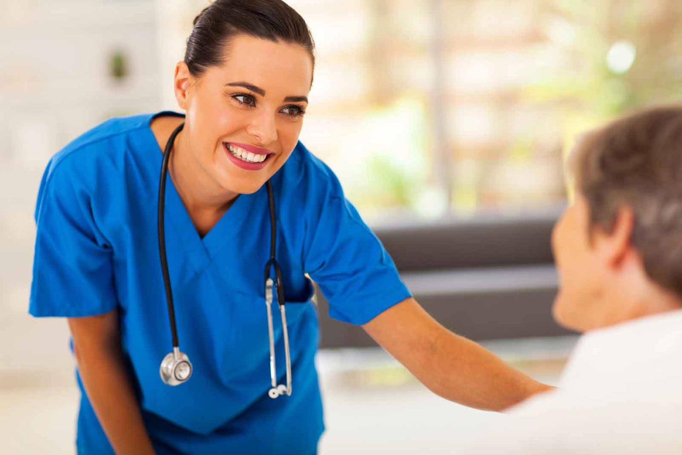A nurse reassuring a client during a visit